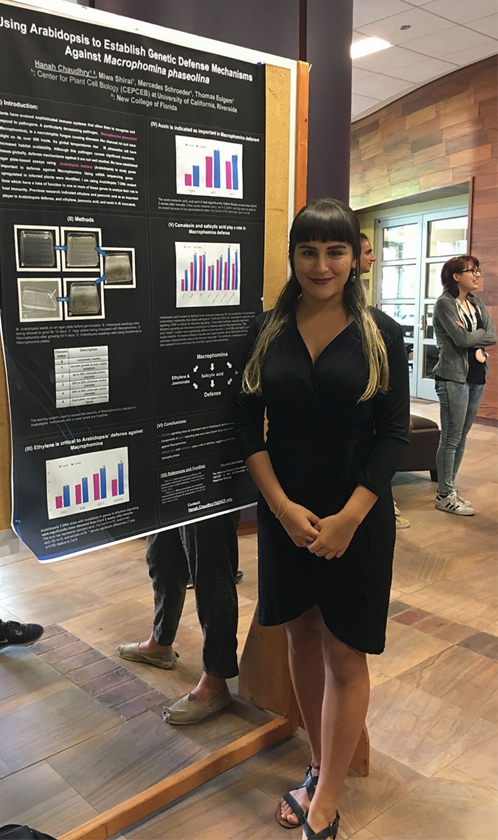 Student with REU poster